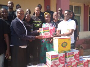 Assistant Director of HVCF Receiving Items Presented by Staff of Access Bank Kaduna/Zaria 